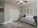 Cozy bedroom with a daybed, plush carpeting, and a closet for storage at 18436 E Celtic Manor Dr, Queen Creek, AZ 85142