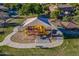 Overhead shot of a community playground with shaded play area, picnic shelter, and green space at 18436 E Celtic Manor Dr, Queen Creek, AZ 85142