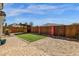 Beautiful backyard with brick pavers, artificial turf, sand pit, and decorative bamboo fencing at 18502 N Celis St, Maricopa, AZ 85138