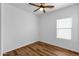 This room features a ceiling fan and a window that allows natural light to enter at 18502 N Celis St, Maricopa, AZ 85138