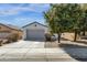 Inviting home with a two-car garage, attractive landscaping, and a well-maintained front lawn at 18502 N Celis St, Maricopa, AZ 85138