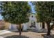 Charming single-story home with stucco exterior and mature trees in a well-maintained front yard at 18502 N Celis St, Maricopa, AZ 85138