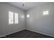 Bedroom featuring neutral walls, carpeted floor, ceiling fan, and windows with shutter at 18925 W Windsor Blvd, Litchfield Park, AZ 85340