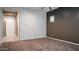 Spacious bedroom featuring neutral paint, carpeted floors, and abundant natural light at 18925 W Windsor Blvd, Litchfield Park, AZ 85340