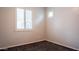 Bedroom with large window and carpet flooring at 18925 W Windsor Blvd, Litchfield Park, AZ 85340