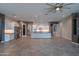 Open-concept kitchen with stainless appliances, center island, and tile backsplash showcases a modern design at 18925 W Windsor Blvd, Litchfield Park, AZ 85340