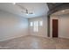 Open living room with recessed lighting, modern tile flooring, and white plantation shutters at 18925 W Windsor Blvd, Litchfield Park, AZ 85340