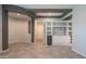Well-lit living area showcasing a wine fridge and custom built-ins, perfect for entertaining or relaxation at 18925 W Windsor Blvd, Litchfield Park, AZ 85340