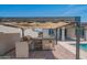 Outdoor kitchen space with a pergola and a stainless steel grill and cooktop at 18925 W Windsor Blvd, Litchfield Park, AZ 85340