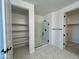 Bathroom features a frameless glass shower, tiled floors, and convenient linen closet at 1909 W Lariat Ln, Phoenix, AZ 85085