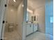 View of a bathroom featuring a double vanity and adjacent toilet area at 1909 W Lariat Ln, Phoenix, AZ 85085