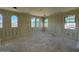 Unfinished bedroom featuring multiple windows providing natural light and unfinished walls at 1909 W Lariat Ln, Phoenix, AZ 85085