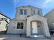 Two-story home featuring a covered entryway, neutral stucco, and multiple windows at 1909 W Lariat Ln, Phoenix, AZ 85085