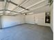 View of a spacious two car garage featuring overhead lighting and utility connections at 1909 W Lariat Ln, Phoenix, AZ 85085
