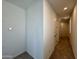 Interior hallway showing neutral wall paint and carpeted flooring leading to other rooms at 1909 W Lariat Ln, Phoenix, AZ 85085