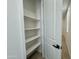A linen closet with white shelves and a full view of the linen storage at 1909 W Lariat Ln, Phoenix, AZ 85085