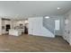 Spacious open-concept floor plan integrating the kitchen, dining, and living areas with tile flooring at 1909 W Lariat Ln, Phoenix, AZ 85085