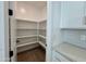 Walk-in pantry provides ample storage space in a well-organized, shelved area in the kitchen at 1909 W Lariat Ln, Phoenix, AZ 85085