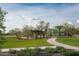 View of the community playground area and covered picnic tables on lush green lawn at 1909 W Lariat Ln, Phoenix, AZ 85085