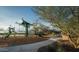 A fun playground with climbing structures, slides, and a shaded seating area for Gathering enjoyment at 1909 W Lariat Ln, Phoenix, AZ 85085