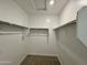 Spacious walk-in closet with shelving units providing ample storage space at 1909 W Lariat Ln, Phoenix, AZ 85085
