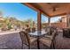 Back patio featuring brick pavers, outdoor dining and comfortable seating at 1926 W Wayne Ln, Anthem, AZ 85086