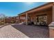 Wide patio features brick pavers, covered dining area, and outdoor kitchen at 1926 W Wayne Ln, Anthem, AZ 85086