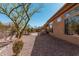 Desert backyard featuring gravel, patio, drought-tolerant landscaping, and a built-in grill at 1926 W Wayne Ln, Anthem, AZ 85086