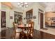 Bright dining room features a wooden table, elegant chairs, and large windows for natural light at 1926 W Wayne Ln, Anthem, AZ 85086