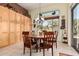 Bright dining room with decorative chandelier and cabinet storage at 1926 W Wayne Ln, Anthem, AZ 85086