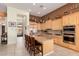 Open kitchen with granite countertops and stainless steel appliances at 1926 W Wayne Ln, Anthem, AZ 85086