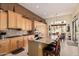 Spacious kitchen featuring a central island with barstool seating and adjoining dining area at 1926 W Wayne Ln, Anthem, AZ 85086