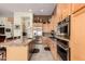 Bright kitchen features stainless steel appliances, granite countertops, and light wood cabinetry at 1926 W Wayne Ln, Anthem, AZ 85086