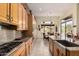 Modern kitchen with stainless steel appliances, granite countertops, and tiled backsplash at 1926 W Wayne Ln, Anthem, AZ 85086