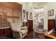 Relaxing living room with a comfortable recliner, wood accents, and view into the dining area at 1926 W Wayne Ln, Anthem, AZ 85086