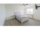 This bedroom features neutral carpet and a ceiling fan, paired with matching dresser and nightstand at 22338 N O Sullivan Dr, Maricopa, AZ 85138