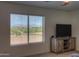 Relaxing bedroom features a great view of the golf course and neighborhood at 22338 N O Sullivan Dr, Maricopa, AZ 85138