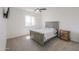 Neutral bedroom featuring large bed, ceiling fan, and window at 22338 N O Sullivan Dr, Maricopa, AZ 85138