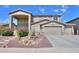 Charming two-story home with a three-car garage and desert landscaping at 22338 N O Sullivan Dr, Maricopa, AZ 85138