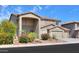 Charming two-story home featuring a three-car garage and desert landscaping at 22338 N O Sullivan Dr, Maricopa, AZ 85138