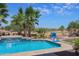 Inviting pool features a rock waterfall, lush landscaping, and beautiful desert views at 22338 N O Sullivan Dr, Maricopa, AZ 85138