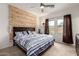 Serene bedroom featuring a decorative headboard wall, natural light, and comfortable bedding at 2376 E Rosario Mission Dr, Casa Grande, AZ 85194