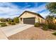 Single-story home featuring low maintenance landscaping and an attached two-car garage at 2376 E Rosario Mission Dr, Casa Grande, AZ 85194