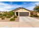 Charming single-story home with a well-maintained front yard, desert landscaping, and a two-car garage at 2376 E Rosario Mission Dr, Casa Grande, AZ 85194