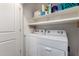 Laundry area featuring modern washer and dryer, and ample storage space at 2376 E Rosario Mission Dr, Casa Grande, AZ 85194