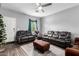 Comfortable living room with neutral walls, stylish furniture, ceiling fan, and a 'welcome' door mat at 2376 E Rosario Mission Dr, Casa Grande, AZ 85194