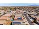 Aerial view of neighborhood homes with swimming pool and solar panels at 23830 W Romley W Ave, Buckeye, AZ 85326