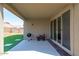 Covered back patio with outdoor grill and view of backyard at 23830 W Romley W Ave, Buckeye, AZ 85326