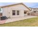 Backyard featuring a covered patio ideal for relaxation or entertaining, and an AC unit at 2439 W White Feather Ln, Phoenix, AZ 85085