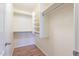 Walk-in closet offering shelves and hanging storage for clothes and accessories at 2439 W White Feather Ln, Phoenix, AZ 85085